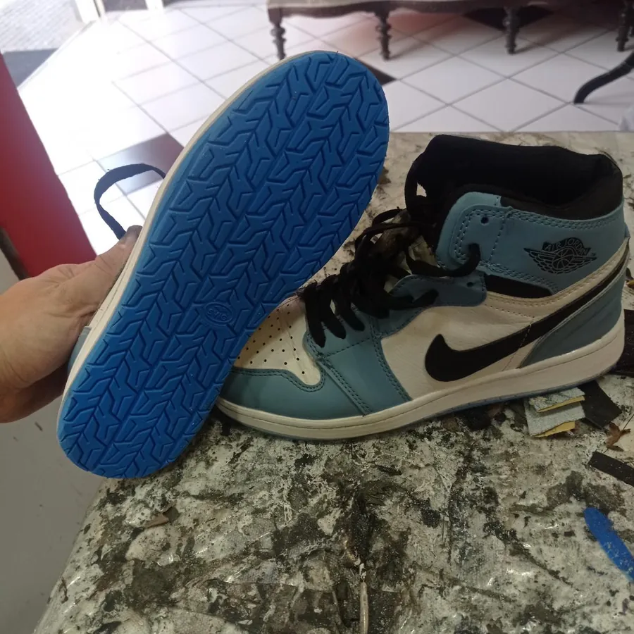 Sneaker with a new blue sole on the Doctor Shoes workbench