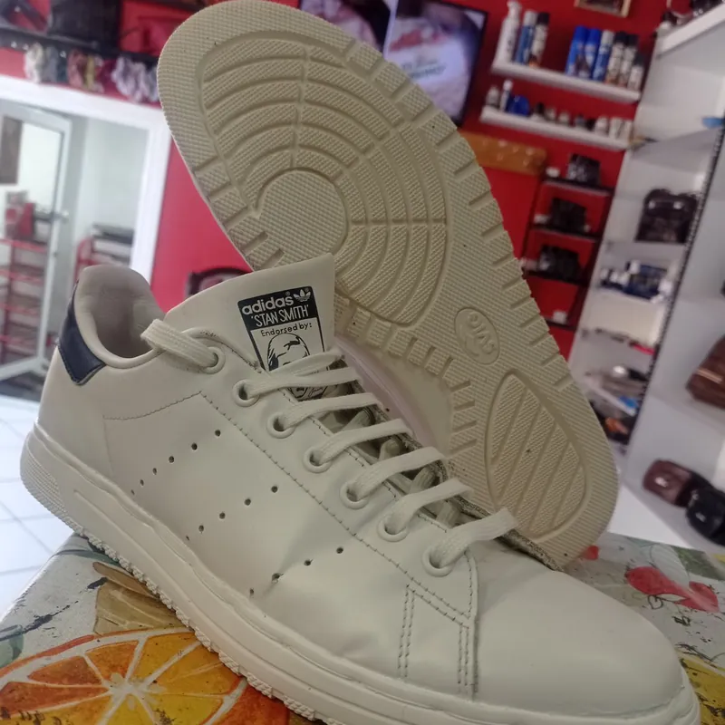 White sneaker with a new sole at Doctor Shoes