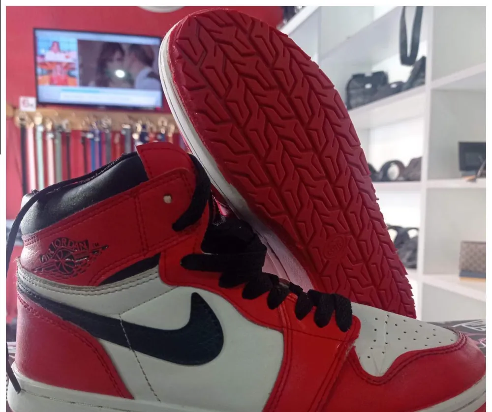 Red sneaker after dyeing and a sole replacement at Doctor Shoes
